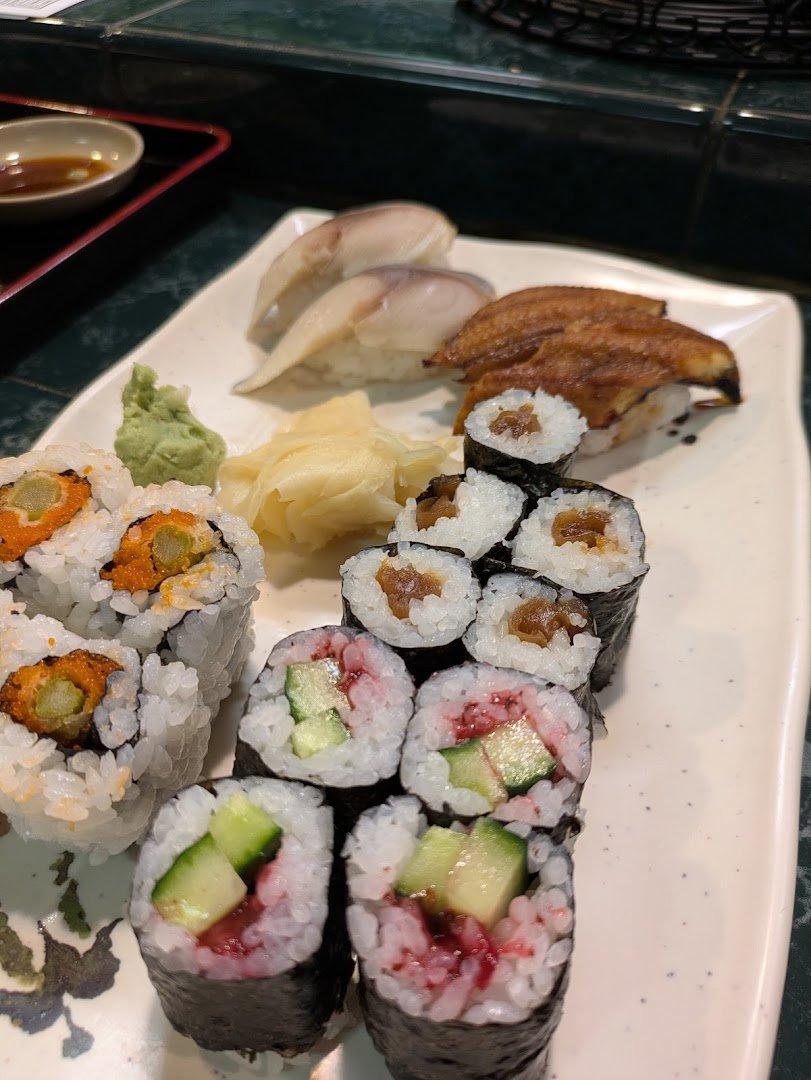 A colorful mix of sashimi and salad.